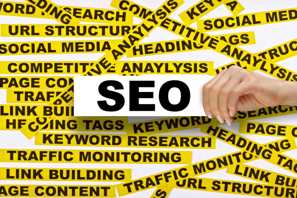 The word SEO with related keywords written around it