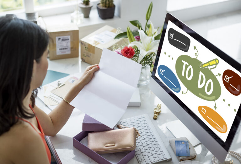 Digital Marketing Agency A woman sits at a desk deep in thought about e-commerce website optimization strategies.